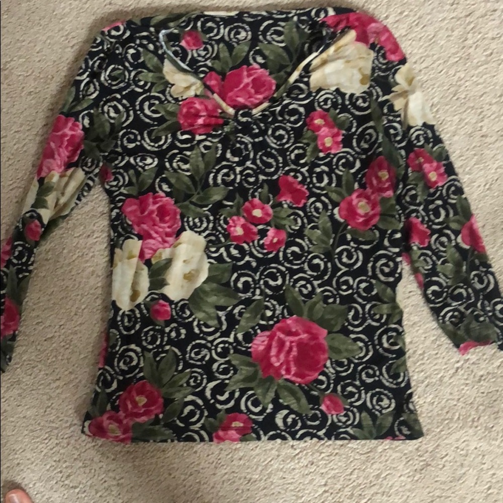 Long sleeve rose patterned shirt.